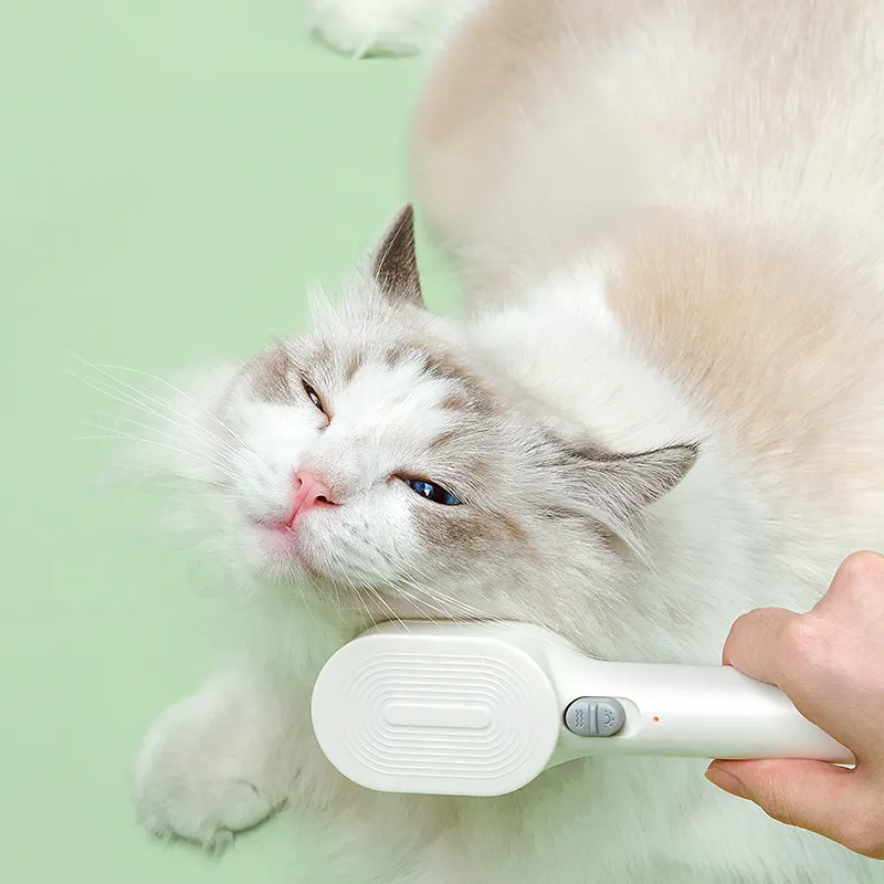 Factory direct sales electric pet grooming comb vibrating massage cat hair care comb one key hair removal